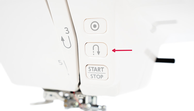 Janome 5300QDC Reverse stitch button